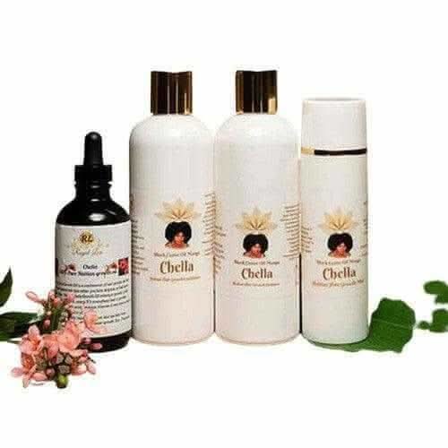Herbal crown starter kit by RoyalLuxsLLC with cleansing oil and hair care bottles arranged with flowers