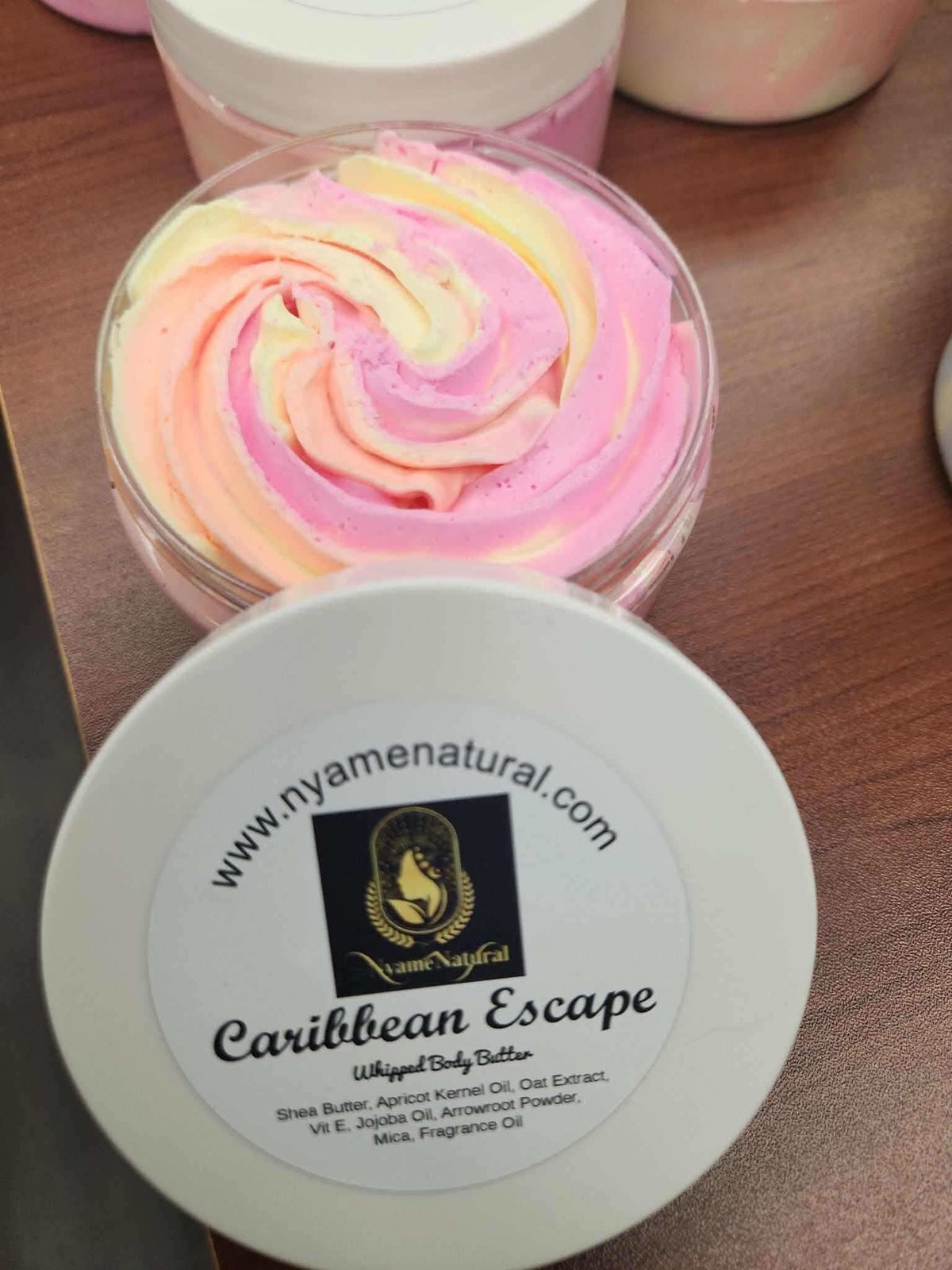 RoyalLuxsLLC Caribbean Escape body butter with whipped pastel pink and yellow cream in clear jar