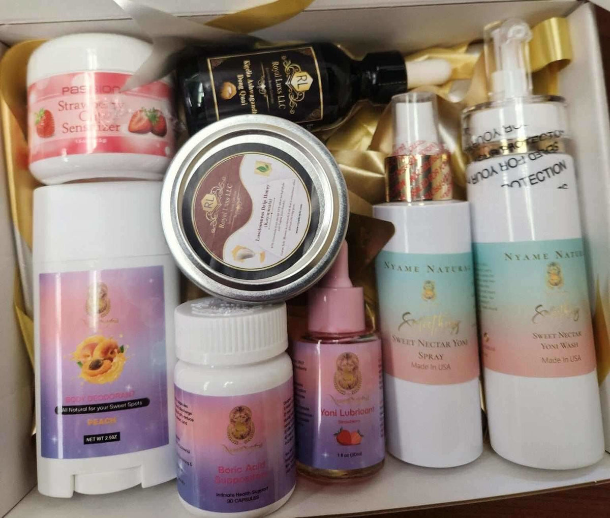 RoyalLuxsLLC herbal wellness box with various body care products including sprays, serums, and lotions