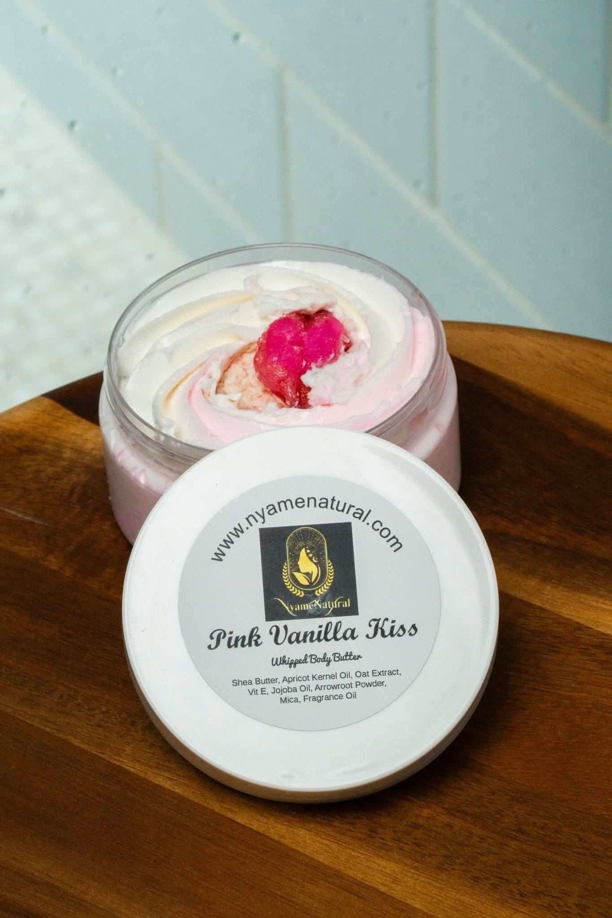 RoyalLuxsLLC pink vanilla kiss body butter in a jar with floral design on top for moisturizing skin
