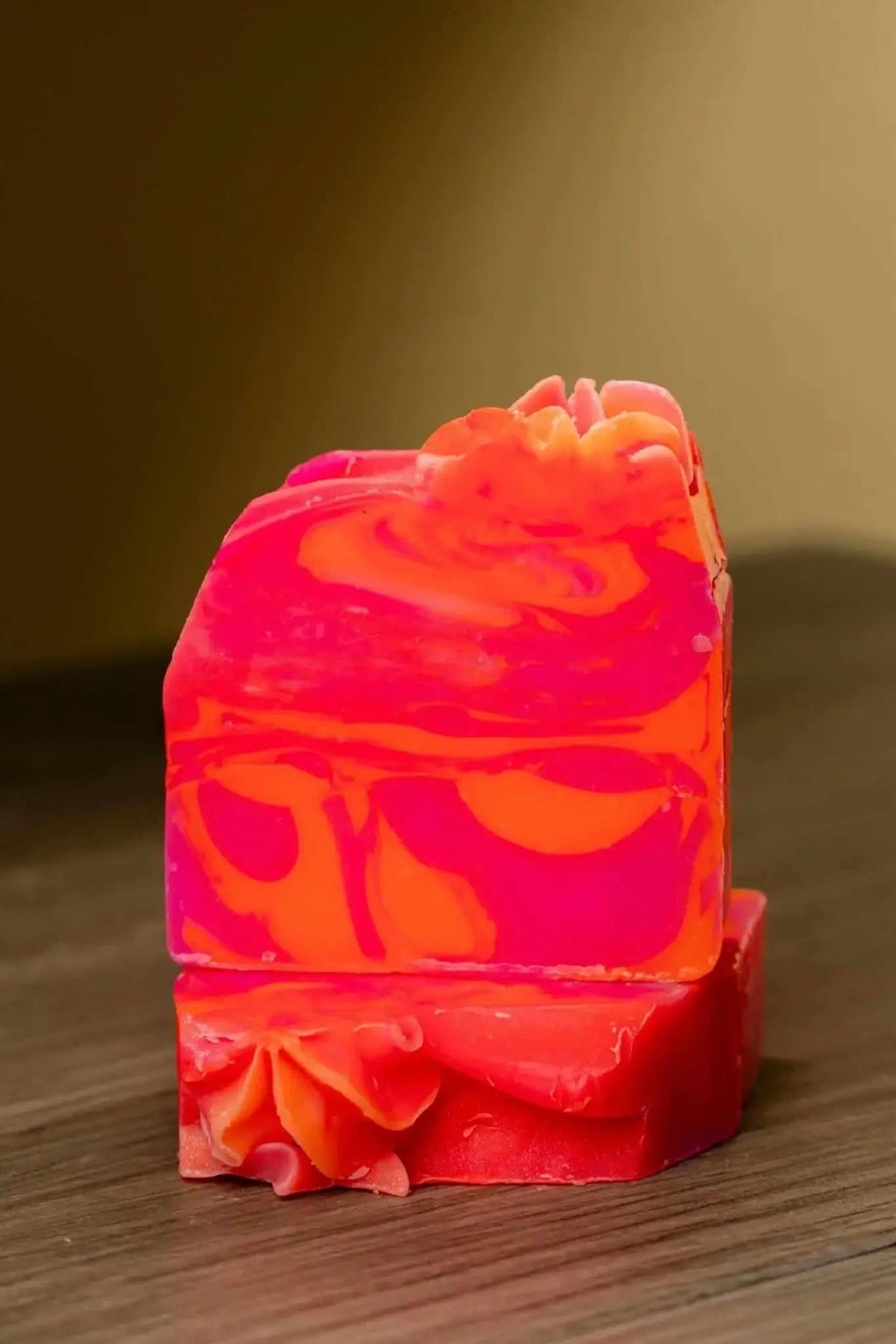 Pink orange citrus soap bar with vibrant swirls stacked on wooden surface by RoyalLuxsLLC