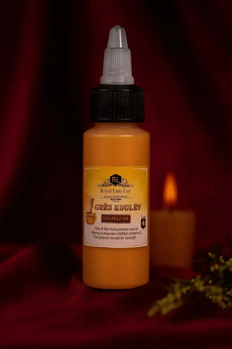 Bottle of Mandingo Miracle Oil by RoyalLuxsLLC with black cap and label on dark red background