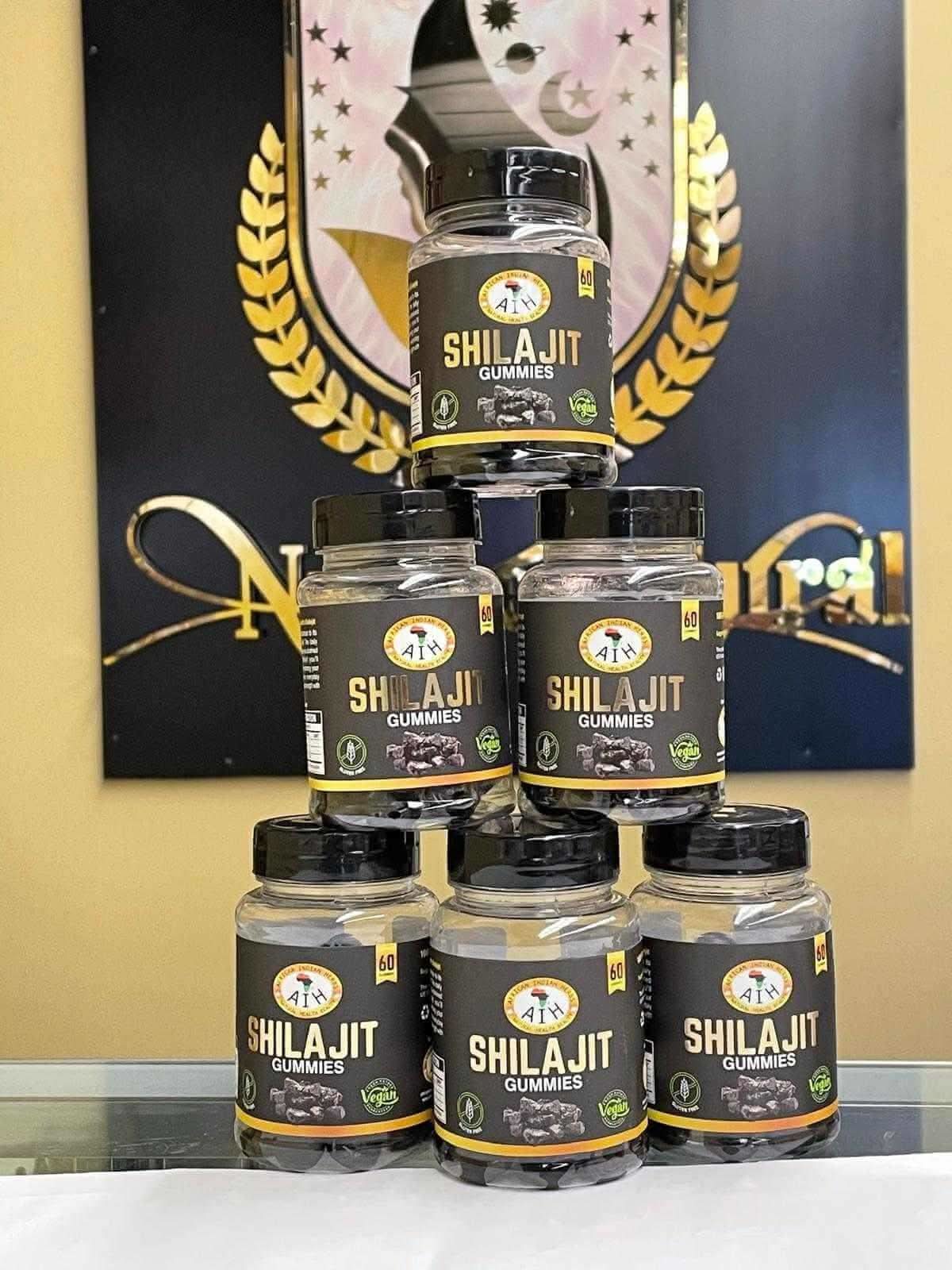 RoyalLuxsLLC Shilajit gummies bottles stacked with black and gold labels displayed indoors