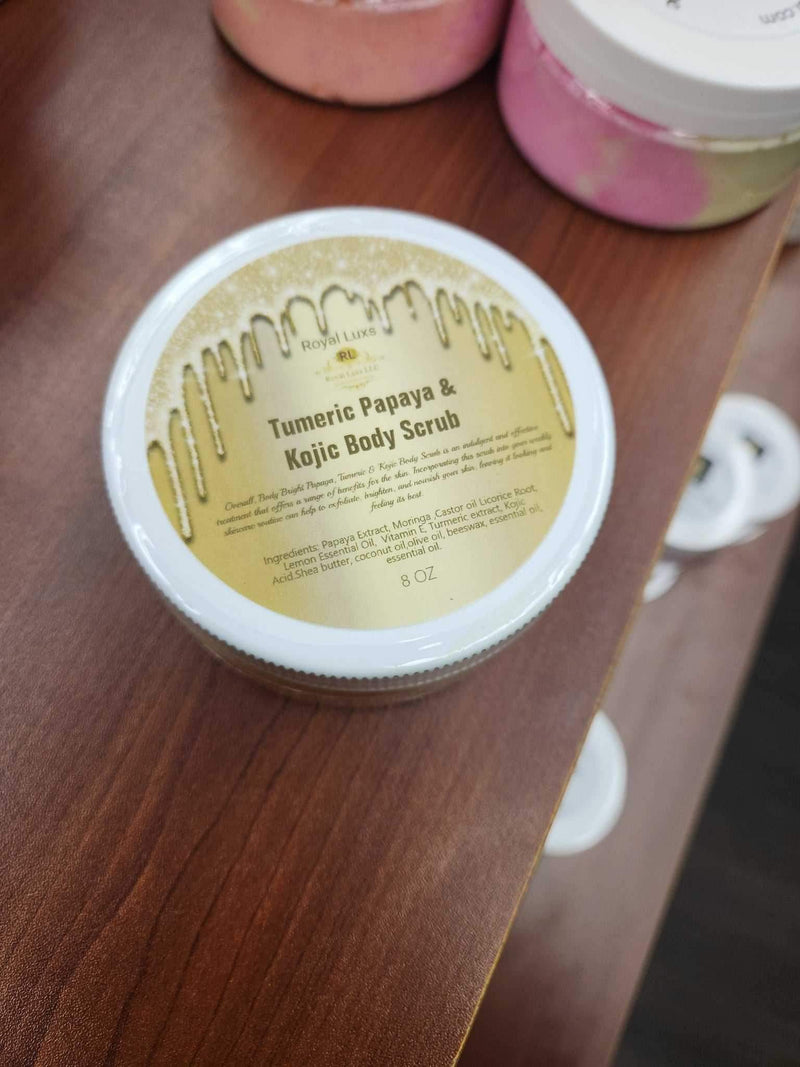 Bright Turmeric' Papaya & Niacinamide Body scrub in a container with a golden label on a wooden surface.