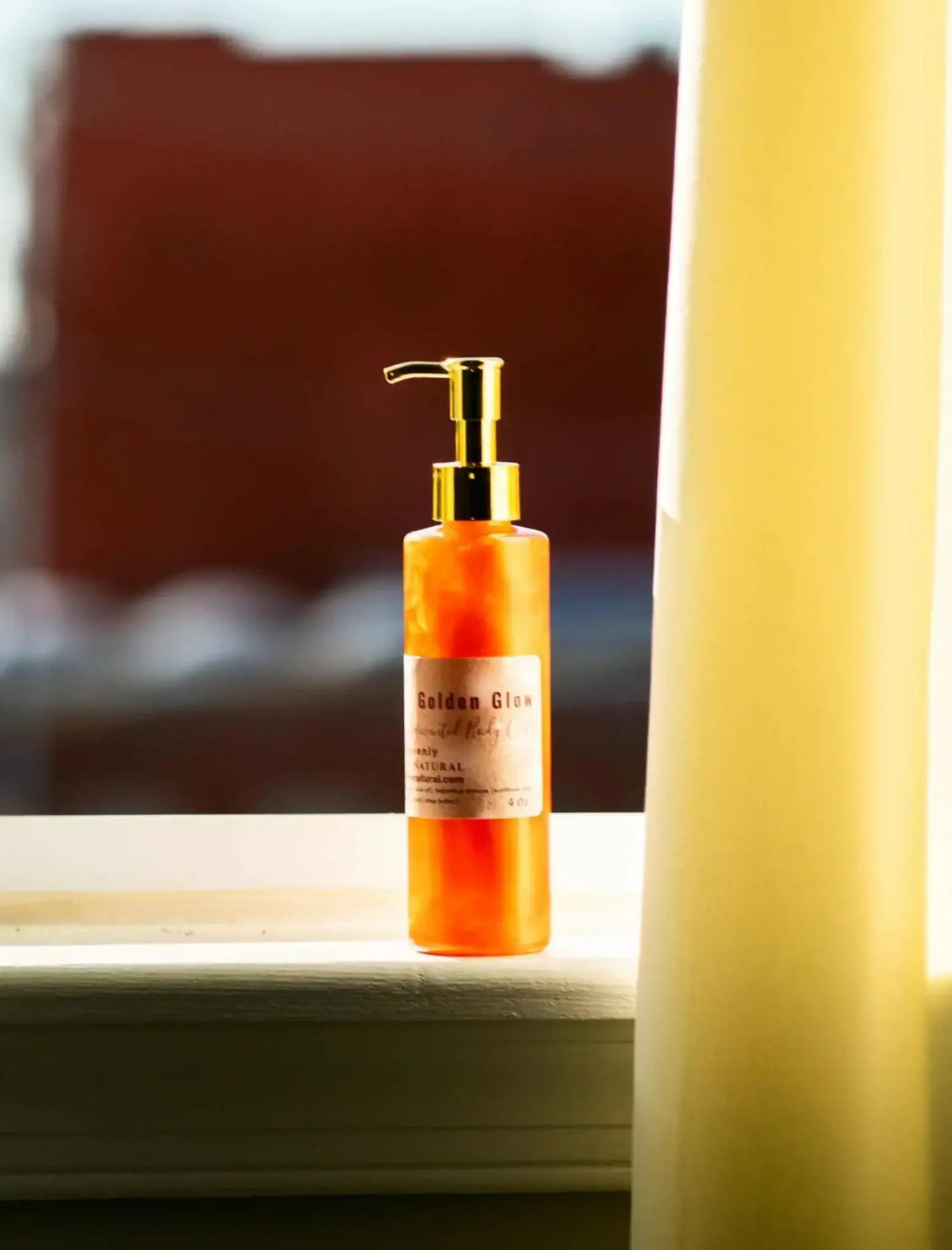 Copper Pigmented Body oil in a glass bottle, showcasing a beautiful glow under soft sunlight.