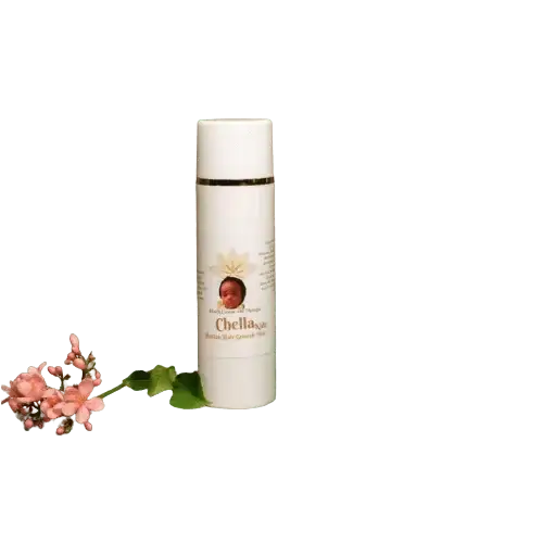 RoyalLuxsLLC Haitian hair growth mist for kids in white bottle with floral decoration on black background