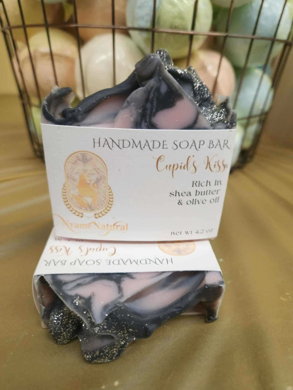 Cupid Kiss handmade soap bar by RoyalLuxsLLC with black and pink swirl design and natural ingredients