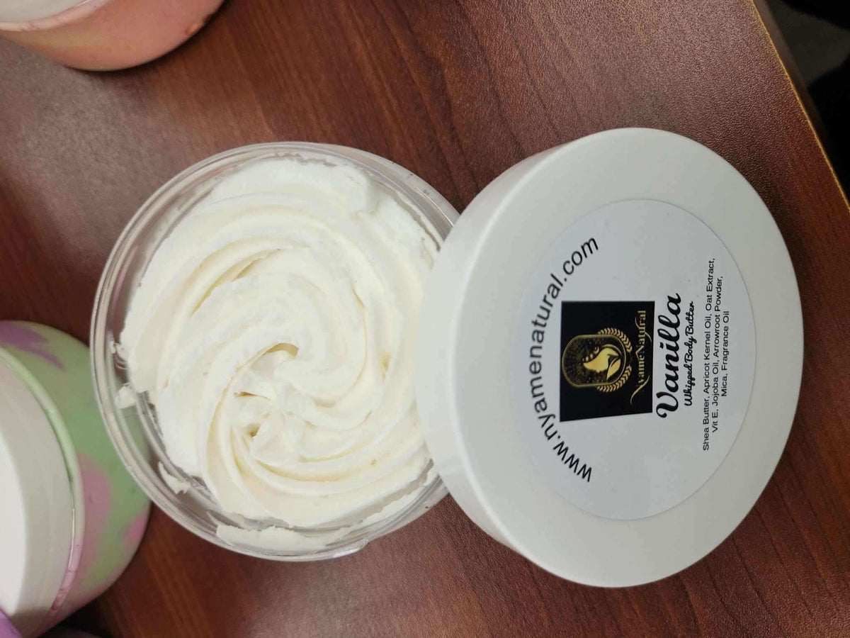 Open jar of RoyalLuxsLLC vanilla body butter with creamy texture on wooden surface
