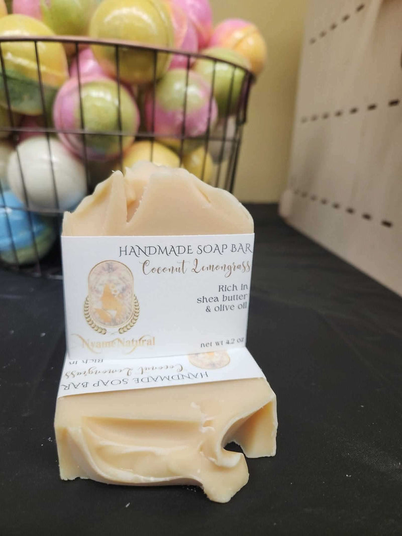 RoyalLuxsLLC handmade coconut lemongrass soap bar with shea butter and olive oil on black surface