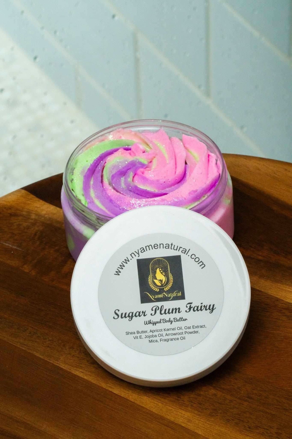 Sugar Plum Fairy body butter by RoyalLuxsLLC with swirled pink, purple, and green colors in a glass jar