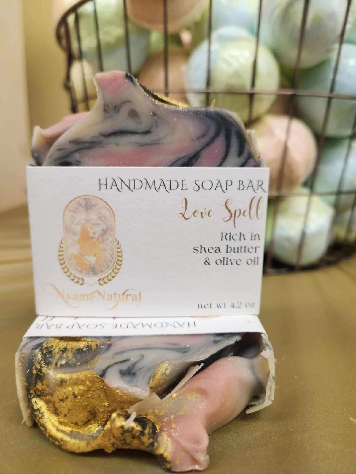 Love spell handmade soap bar by RoyalLuxsLLC with rich shea butter and olive oil in swirling pink black and gold design