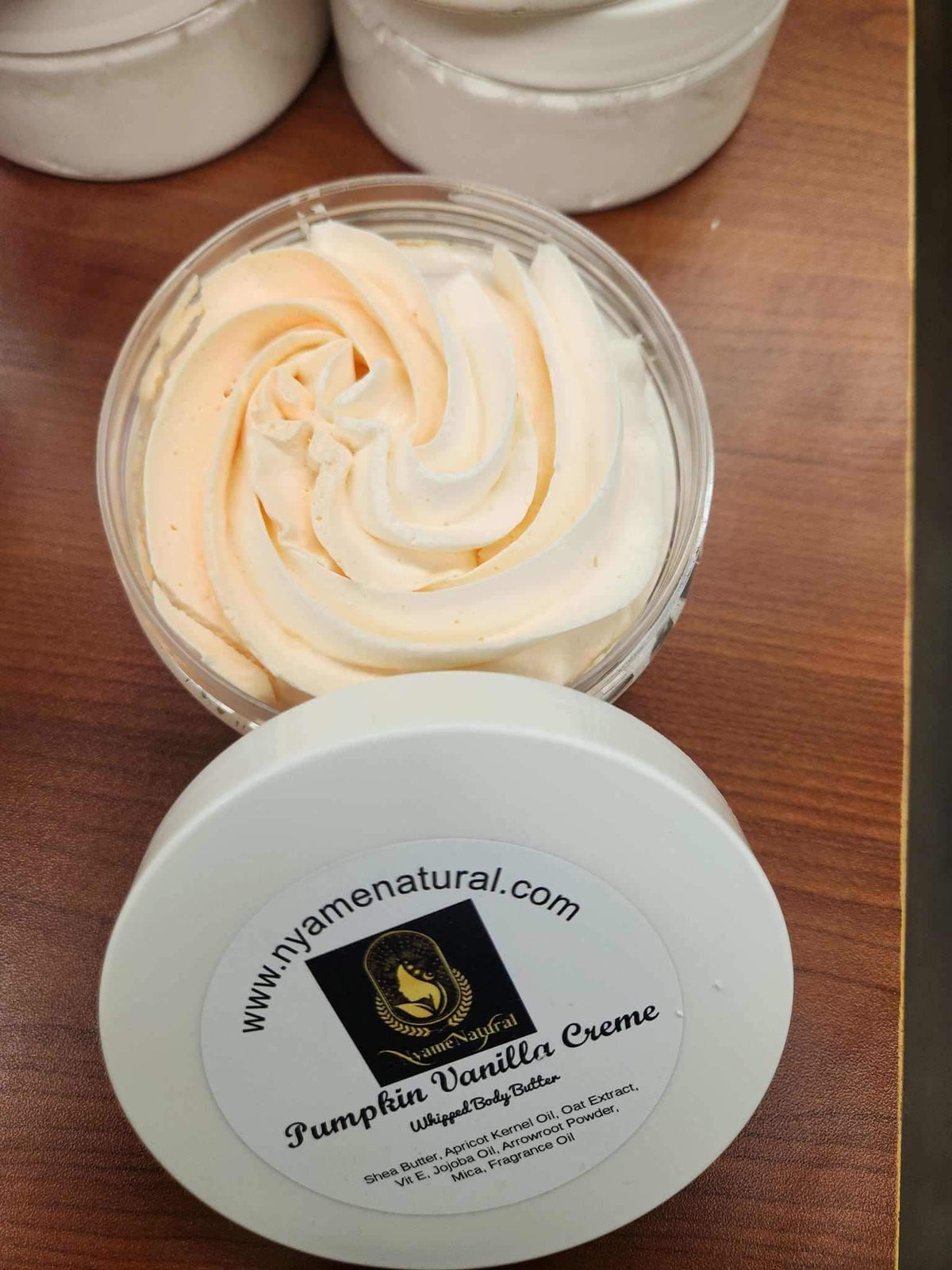 Pumpkin Vanilla cream Body butter in a jar with a creamy texture and a warm color, ideal for hydration.