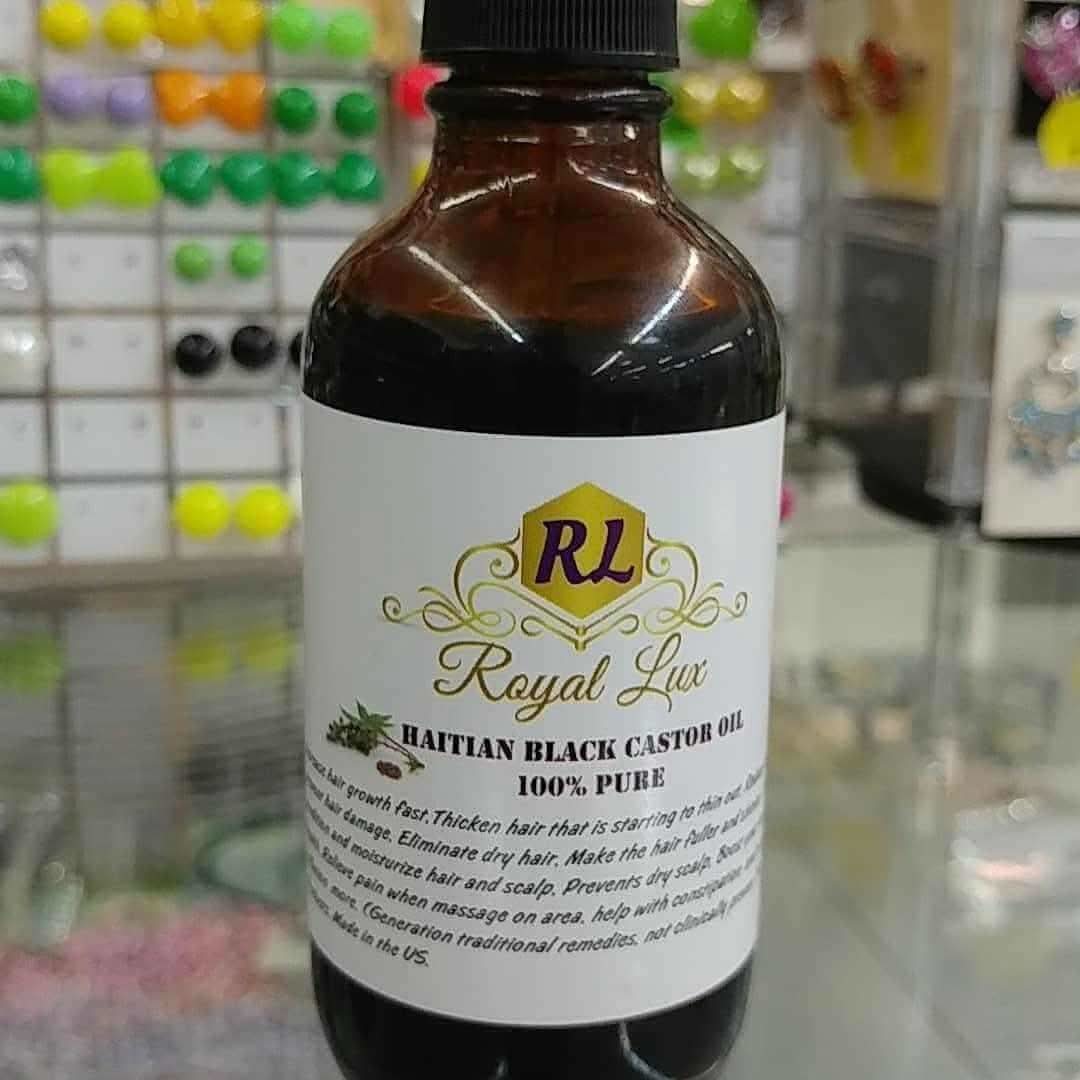 RoyalLuxsLLC bottle of 100% pure Haitian black castor oil in amber packaging for hair care
