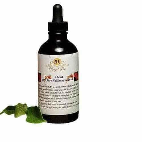 RoyalLuxsLLC Haitian hair growth oil bottle with dropper and green leaves on white background