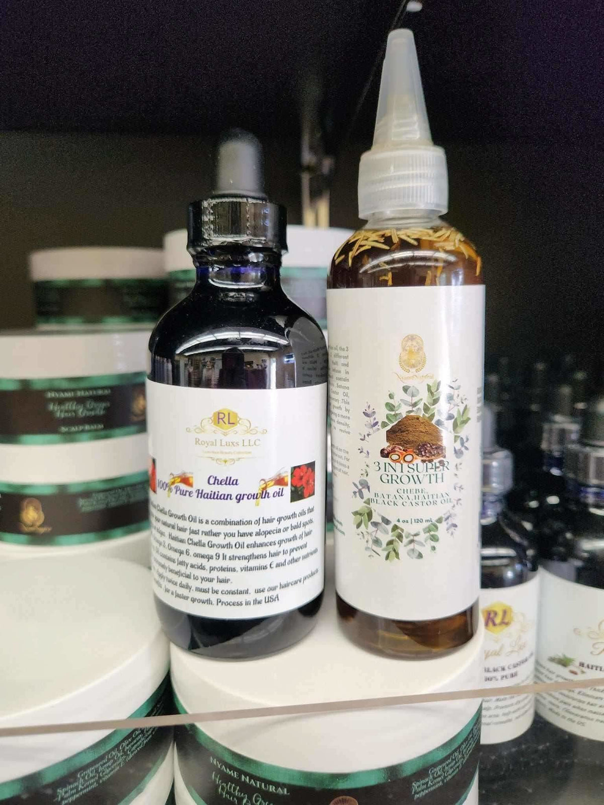 RoyalLuxsLLC herbal hair growth duo bottles with natural ingredients and dropper caps on display