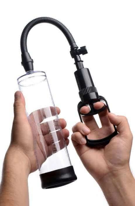 Herbal wellness pump with clear cylindrical chamber and black flexible hose held in two hands