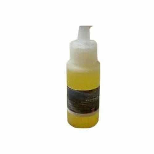 RoyalLuxsLLC Mandingo Miracle Oil in clear pump bottle with yellow liquid inside