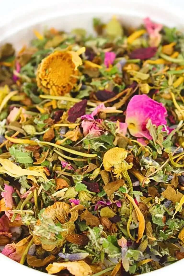 Close-up of colorful yoni steam herbal blend with dried flowers and leaves from RoyalLuxsLLC