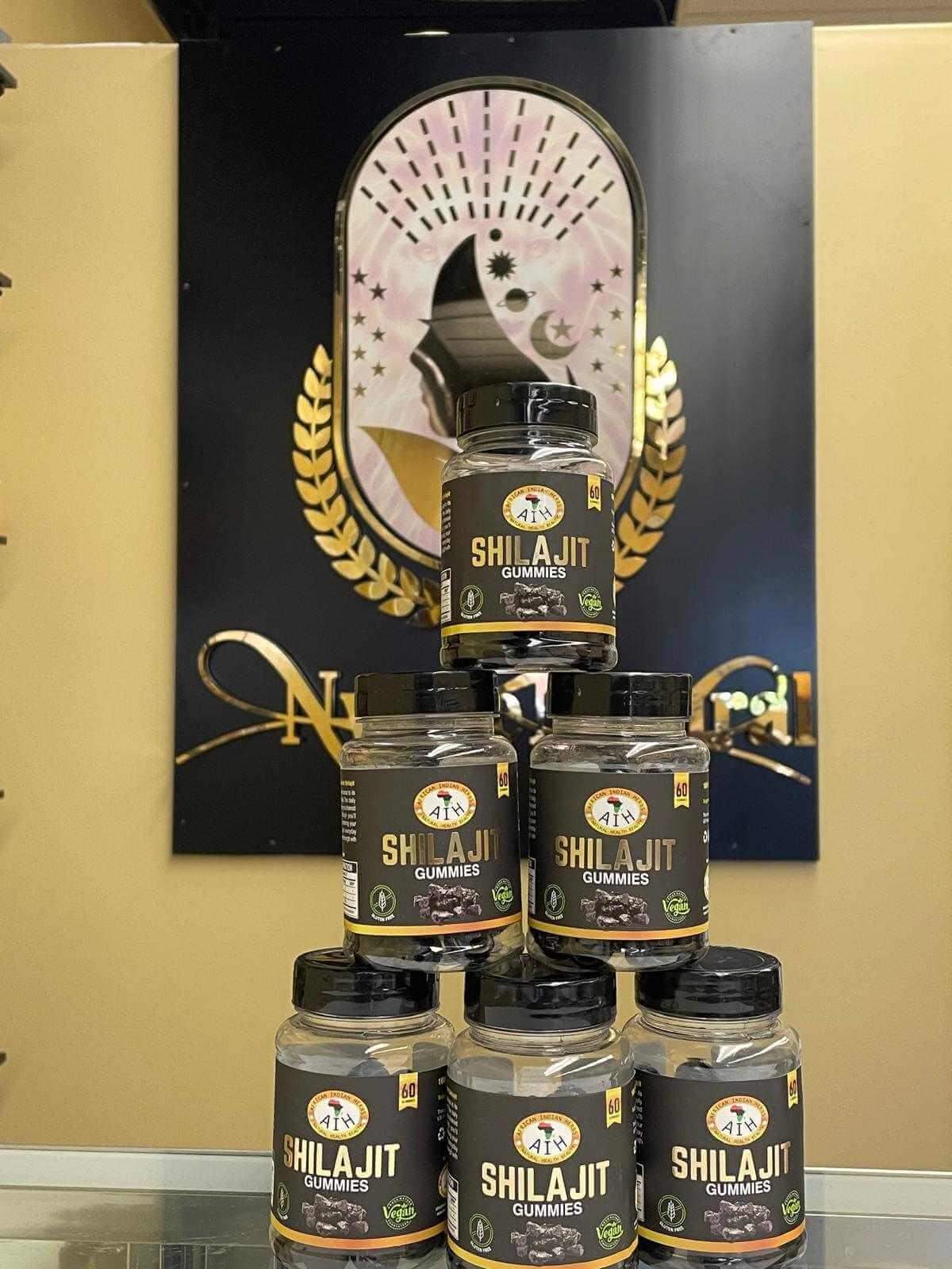 Shilajit Gummies stacked on display against a decorative background, promoting natural energy and wellness.