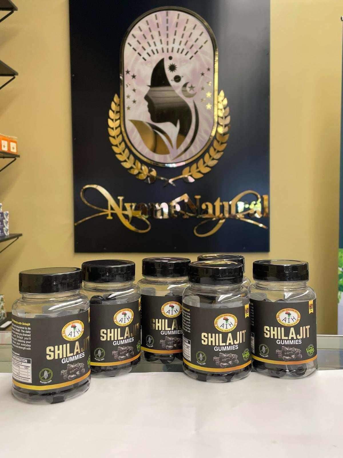 Shilajit Gummies bottles displayed in front of Nyra Natural logo, highlighting energy boost and detox benefits.