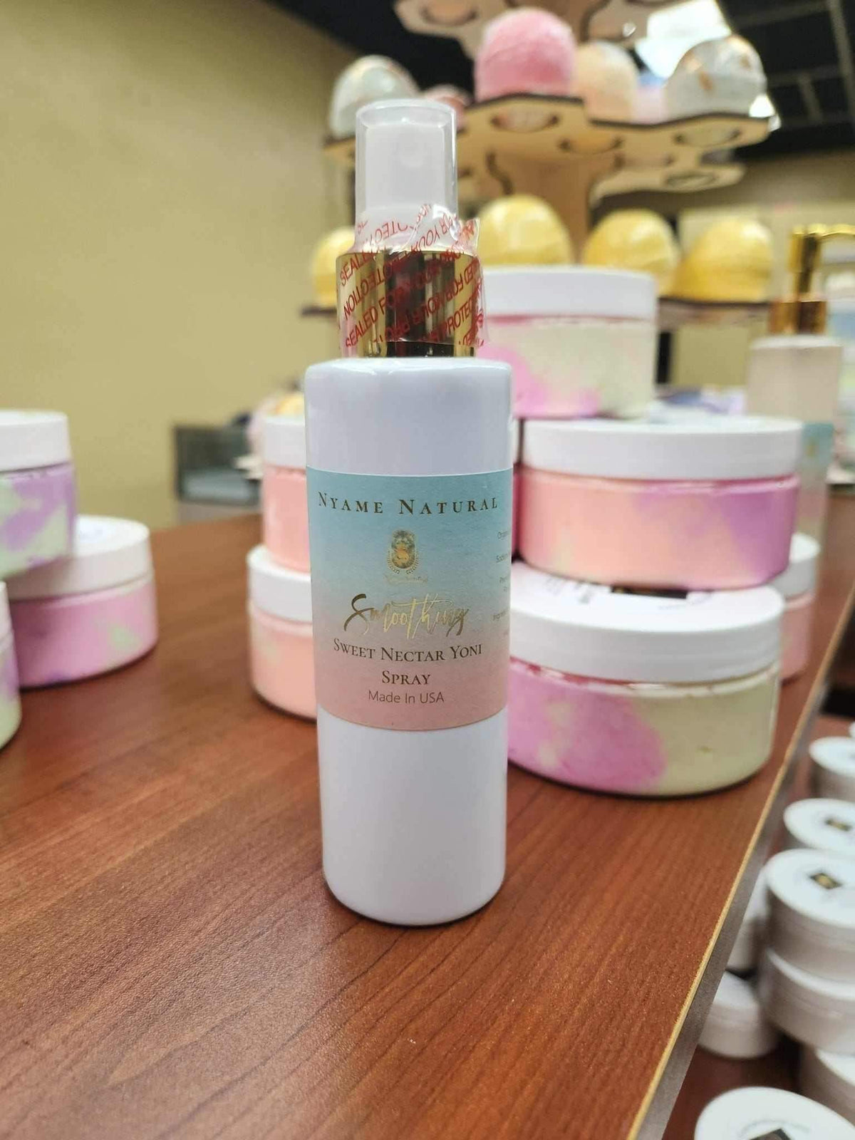 Sweet Yoni Spray Small displayed on a shelf, promoting personal hygiene and freshness with herbal tonic benefits.
