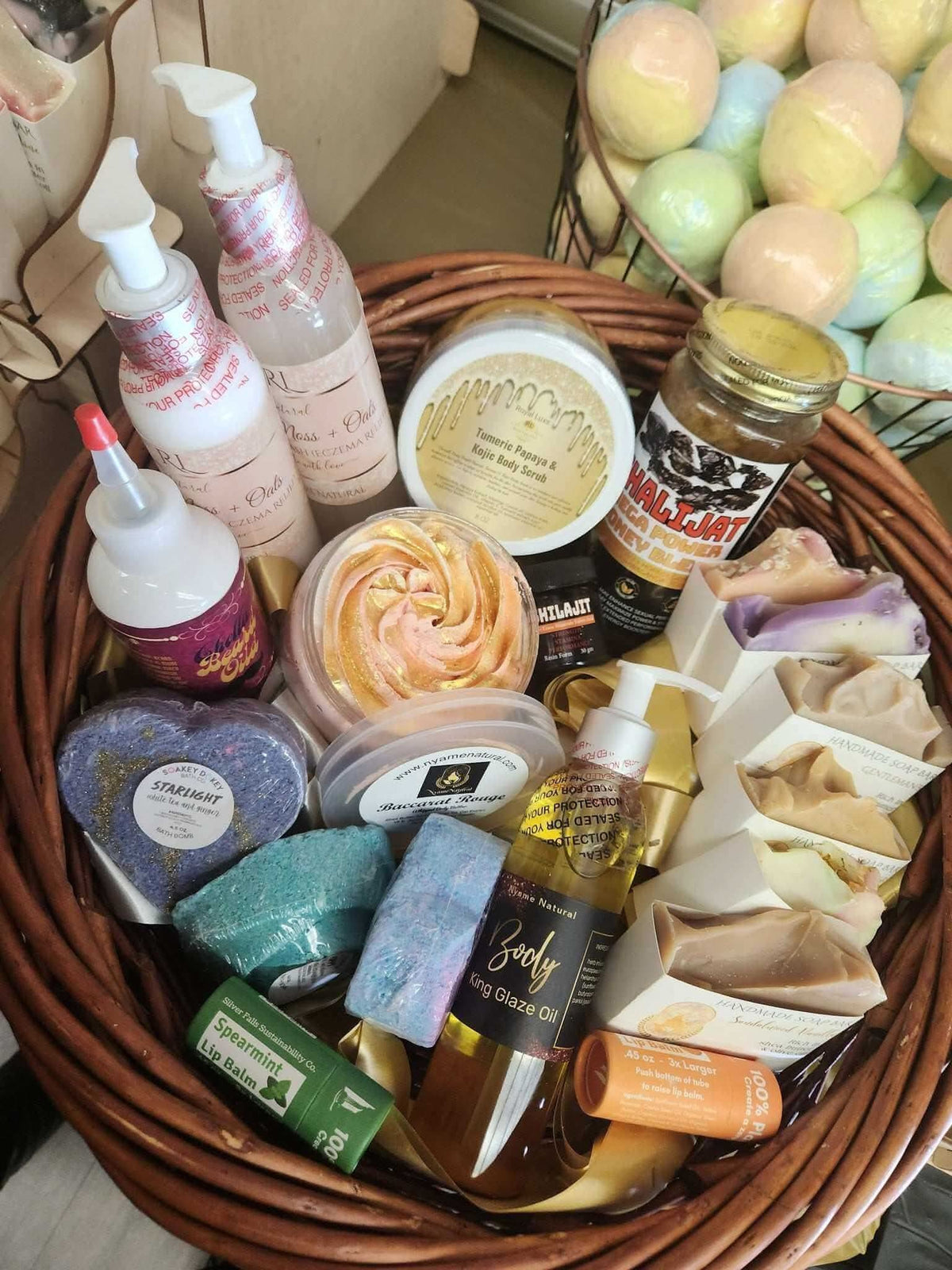 Relaxation gift basket for men with bath bombs, body lotion, essential oils, and handmade soaps